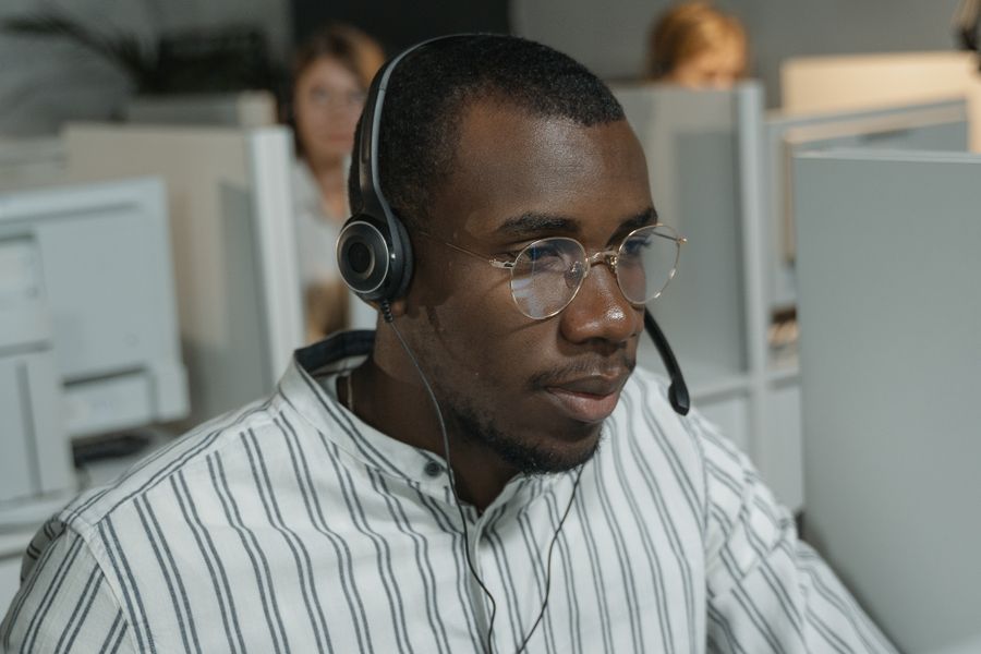 A consultant on a client call with a headset
